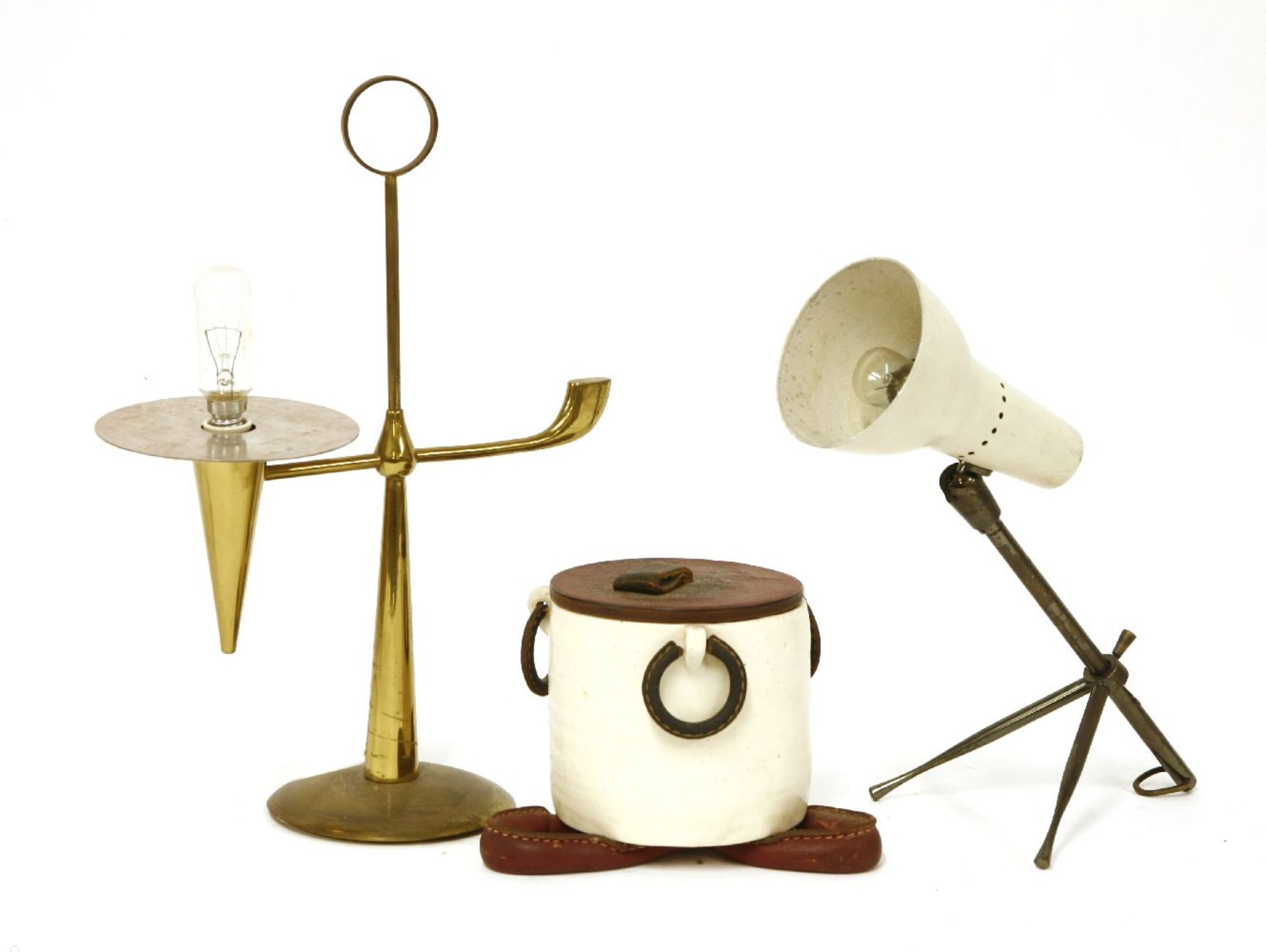 An Italian pottery and leather-mounted jar and cover,a table lamp, with a cream shade, anda brass