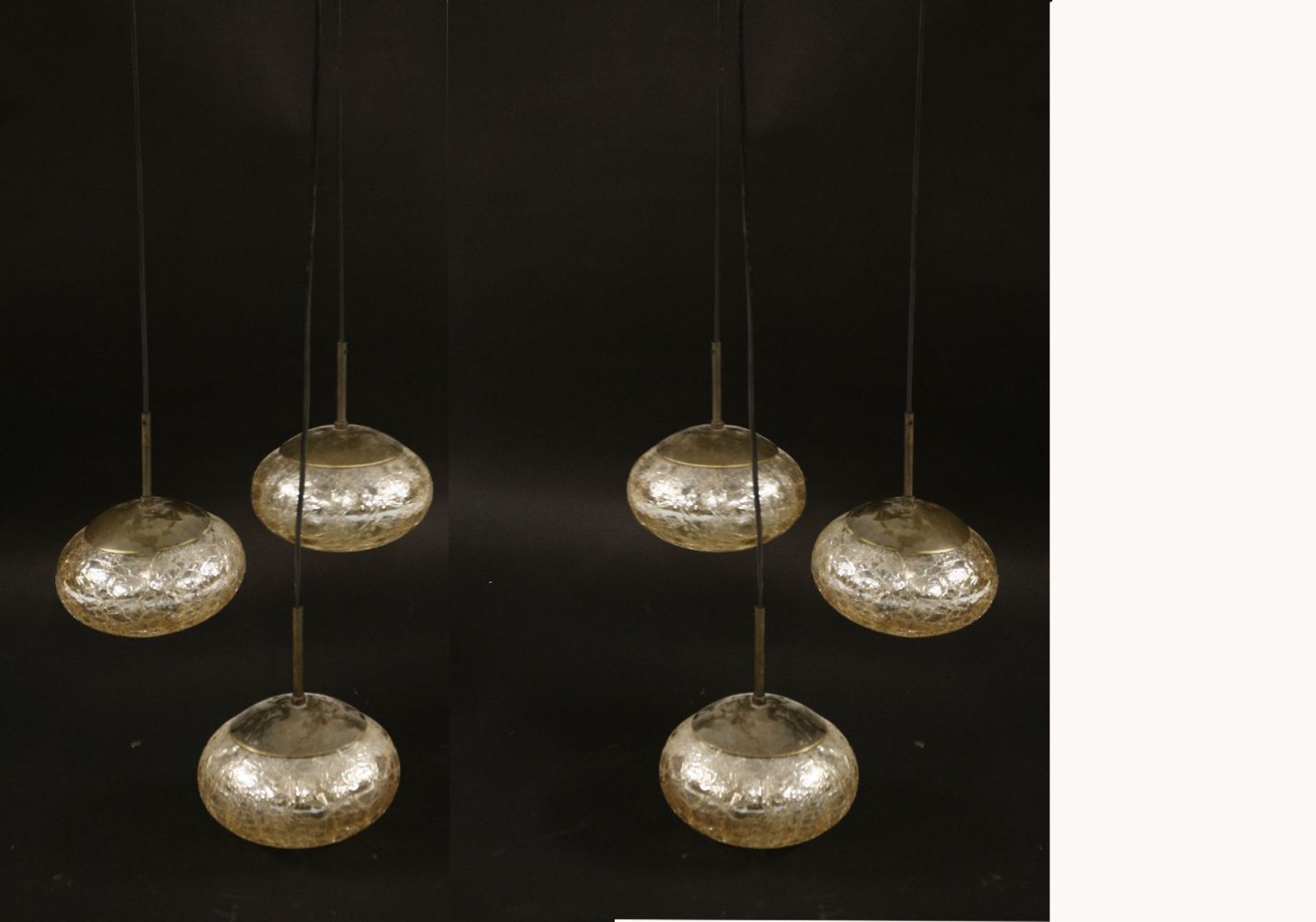 A pair of Italian three-light hanging ceiling lights, each with amber crackled glass shades, 105cm