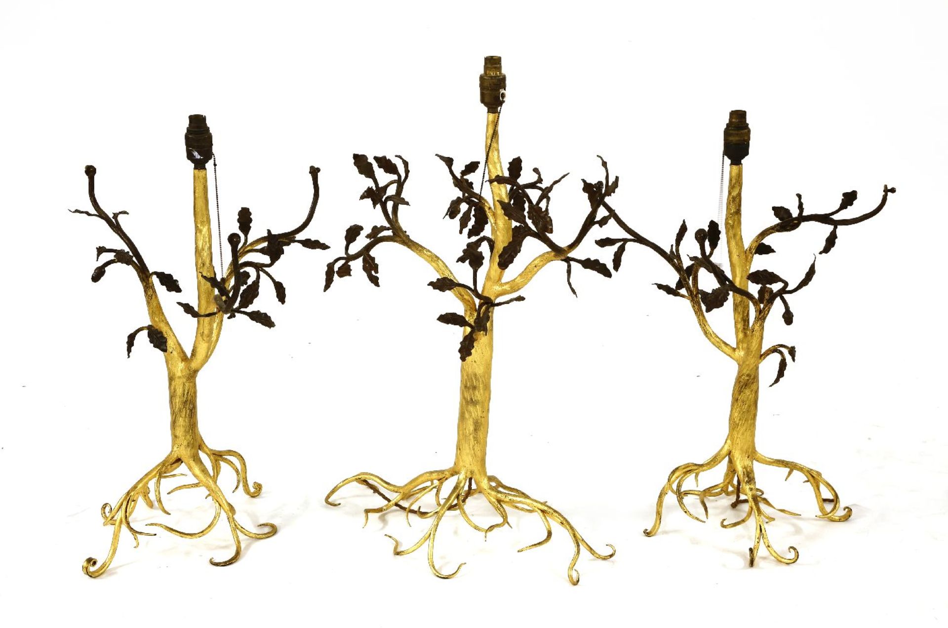 A suite of three gilt and patinated wrought iron table lamps,American, c.1900, each naturalistically
