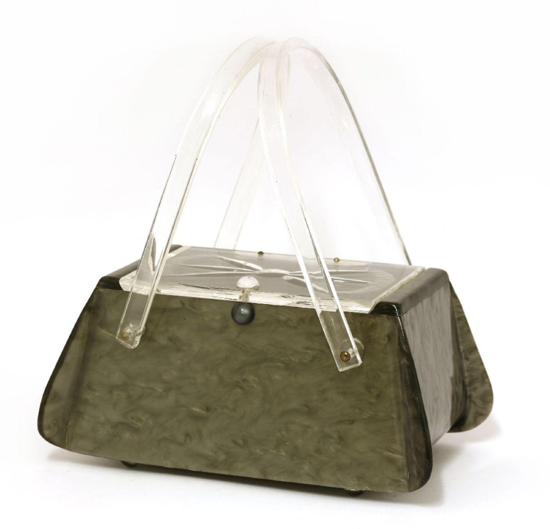 A grey marble effect lucite handbag,of rectangular form with a clear hinged lid, etched with a bow