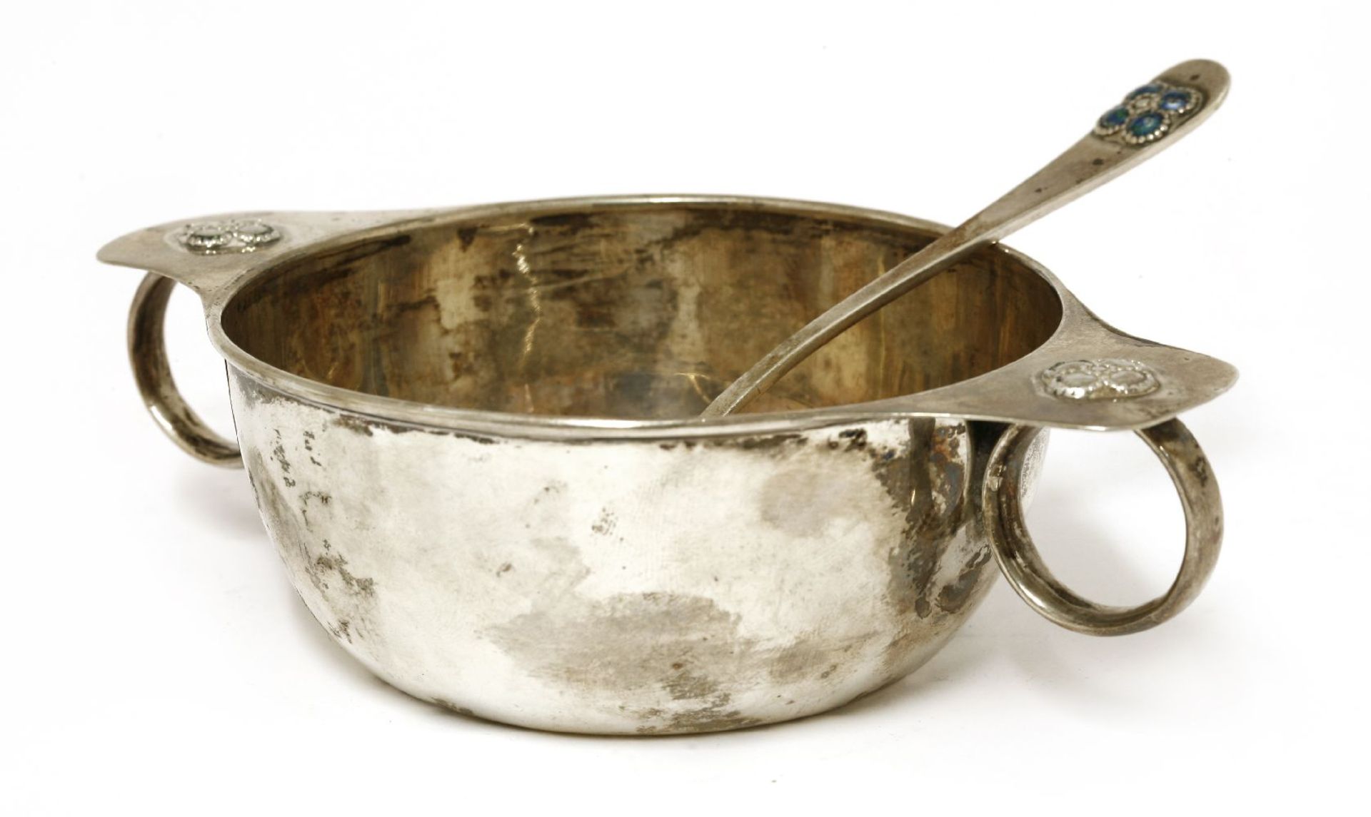 A silver twin-handled porringer,Liberty & Co., Birmingham, 1910,with flower details,16cm wide,