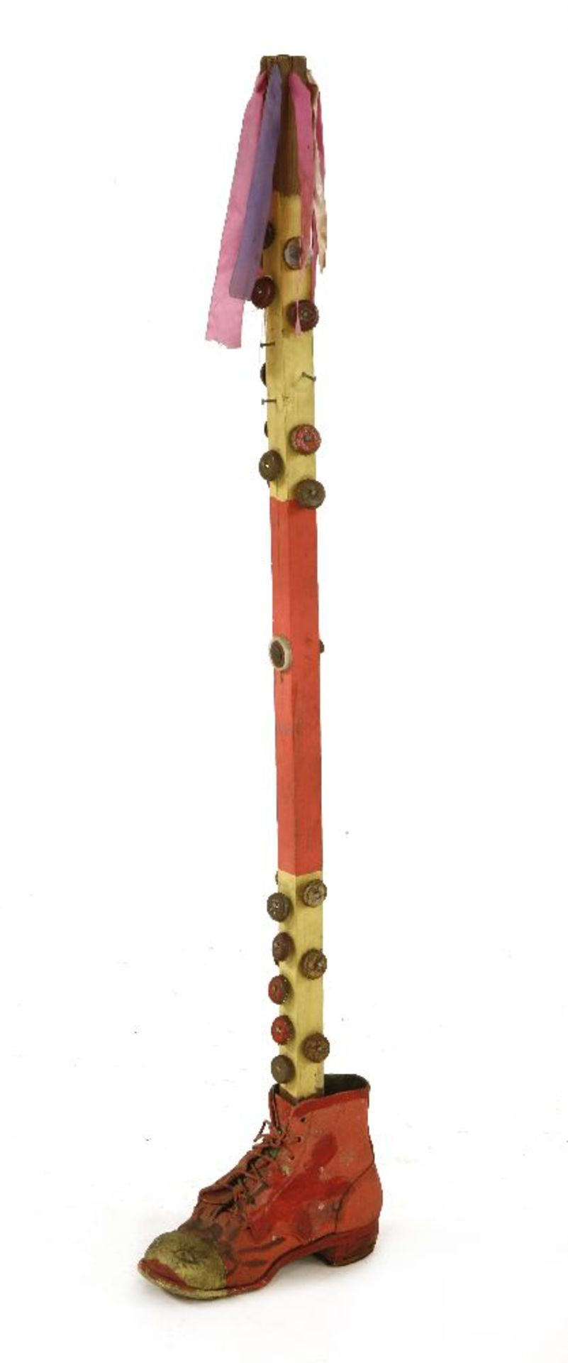 A MORRIS DANCER'S STICK, painted finish with applied bottle caps and red boot to the base, 118cm