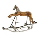 A FRENCH ROCKING HORSE,19th century, carved wood with metal head and fittings, made by the Auguste