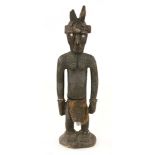 A DEVIL FIGURE,mid-20th century, a tribal carved wooden devil figure, from the Sepik River, Papua