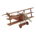A PAINTED METAL WW1 TRIPLANE MODELmid-20th century, with external prop and engine,nose to tail
