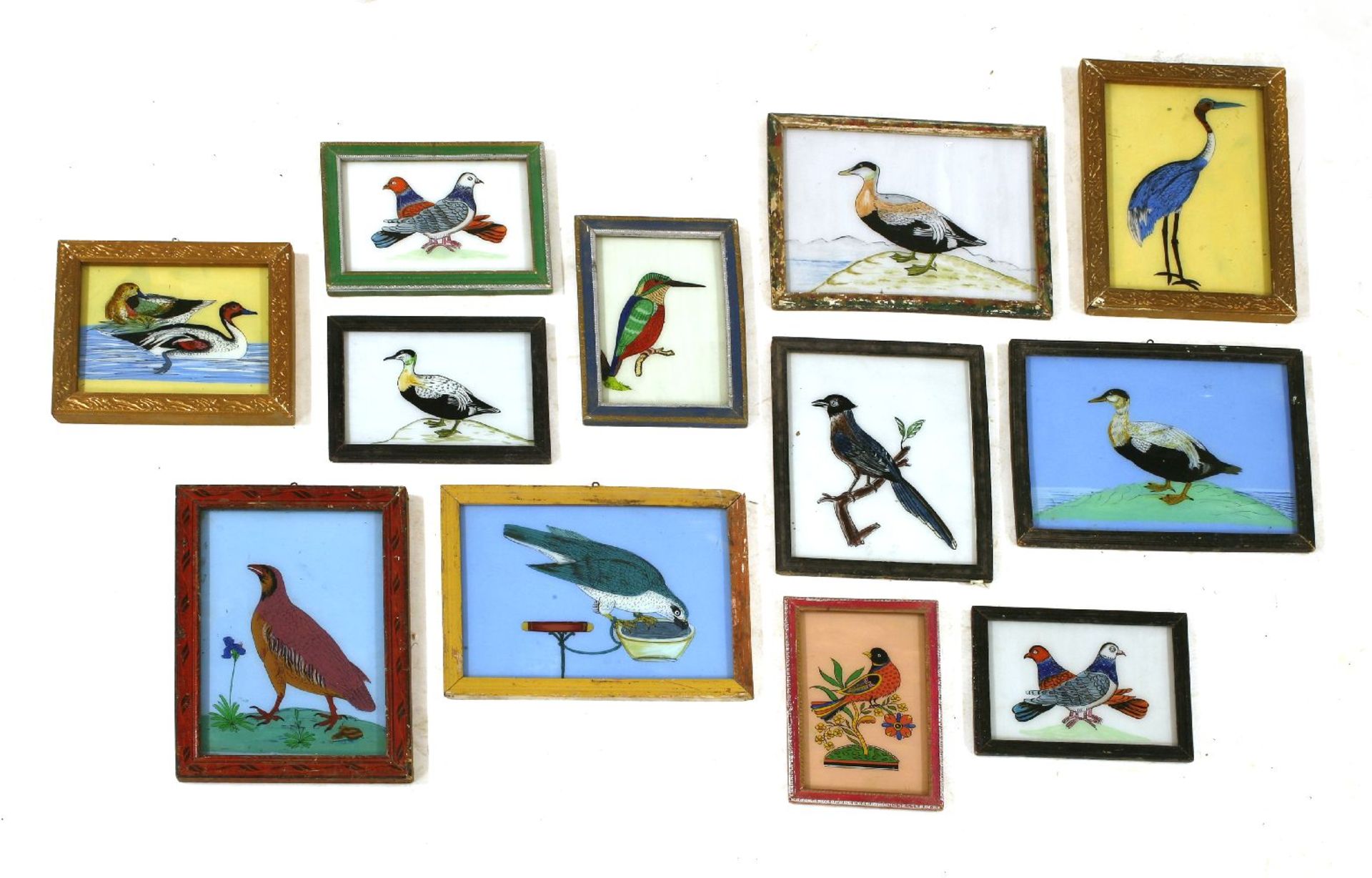 INDIAN REVERSE GLASS PAINTINGS OF BIRDS,late 20th century, a charming group of twelve Indian reverse