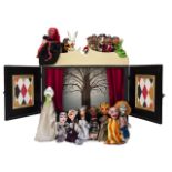 A PUPPET THEATRE,late 20th century, an unusual puppet theatre with fifteen wooden headed puppets,