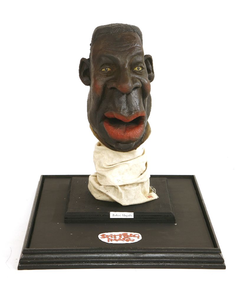 ROBERT MUGABE,1980/90s, an original Spitting Image puppet head of Robert Mugabe, mounted in a