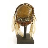 ANCESTOR HUMAN SKULL early 20th century, a tribal ancestor Asmat-style skull,