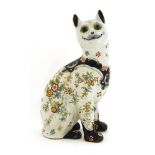 AN EMILE GALLÉ-STYLE FAIENCE POTTERY CAT,c.1900, French, an attractive painted and transfer