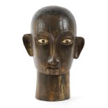A TORAJA TAU TAU HEAD,1950s, a carved wood and bone tribal Toraja Tau Tau head from South