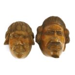 SOUTH SEA ISLANDS,early 20th century, a pair of finely carved wall portraits of a Polynesian couple,
