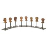 EIGHT CARVED WOODEN PUPPET HEADS,19th century, made in Germany or the Netherlands, boxwood with