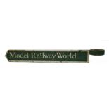 'MODEL RAILWAY WORLD',1960s/70s, a heavy cast iron silver and green sign with post mount,82 x 10cm