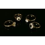 Four assorted rings, to include a gold sapphire and opal cluster ring, claw set to a plain
