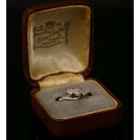 A gold three stone diamond ring, stamped 18ct PLAT, size K½, 2.67g