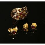 A five row garnet set ring joined as one, tested as approximately 9ct gold (with a high zinc