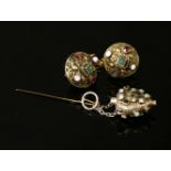 Two Austro-Hungarian gilt metal gem set buttons, each dome shaped button rub set with emeralds,