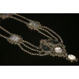 An antique silver gilt specimen agate swag or festoon necklace,with a scrolled, milled wire