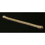 A 9ct gold four row curb link bracelet, with concealed box clasp, 52.46g