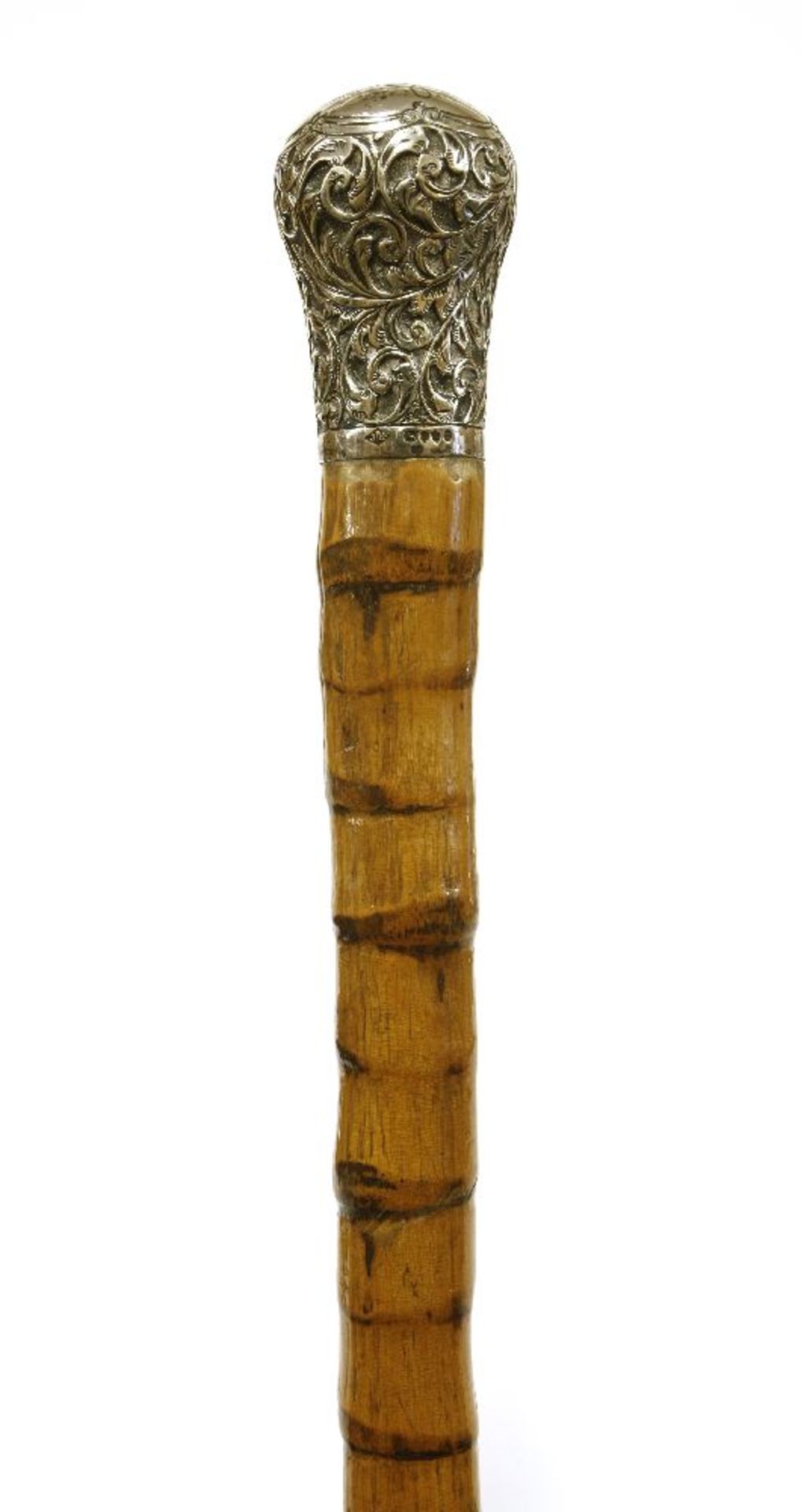 An Anglo-Burmese hardwood walking stick with silver knop,c.1870, raised with three attendants, the