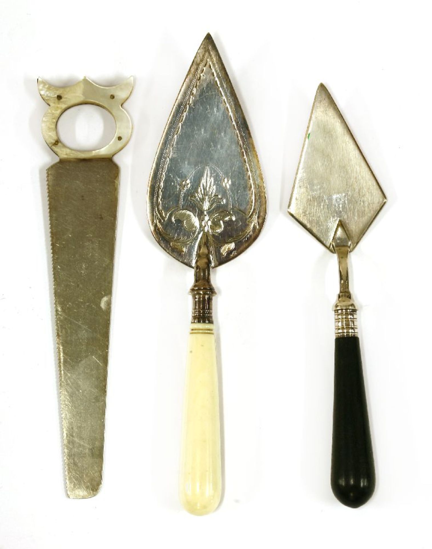 A silver-plated cheese saw,with a mother-of-pearl handle,an ebony and plated miniature trowel,with