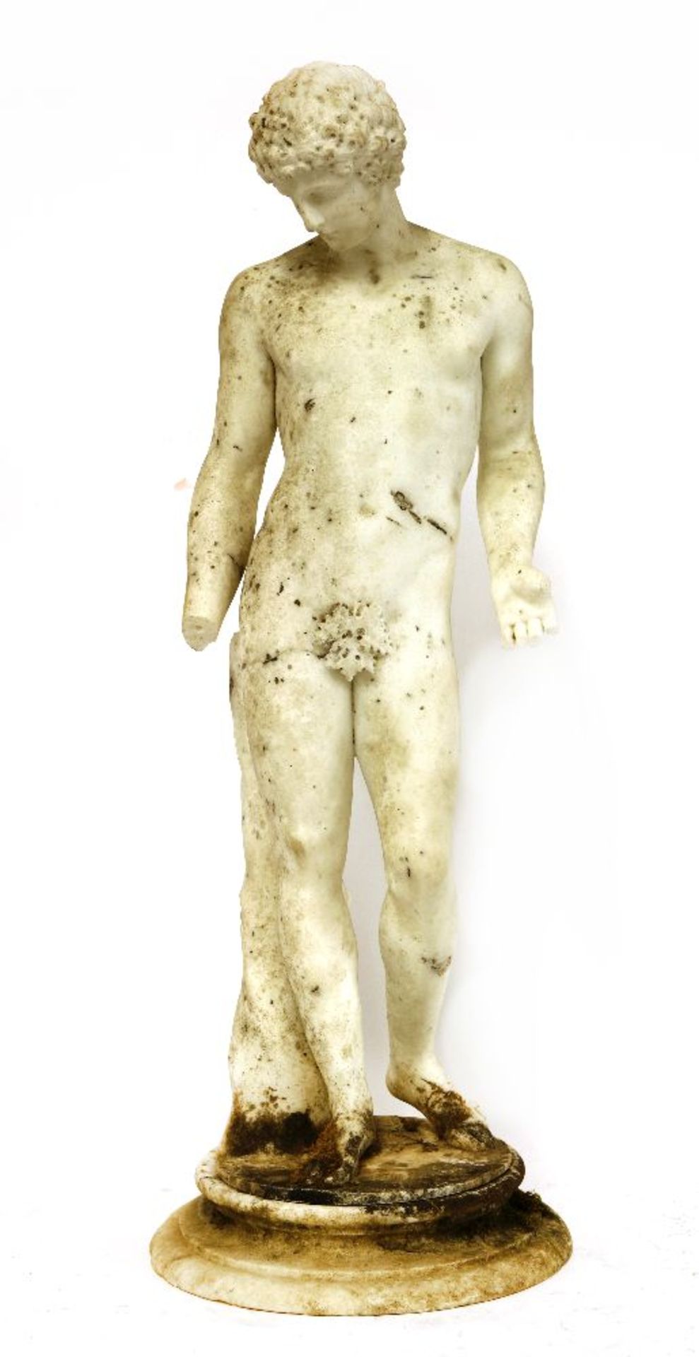 A carved marble figure of a standing man, 19th century, after the antique, on an octagonal base,