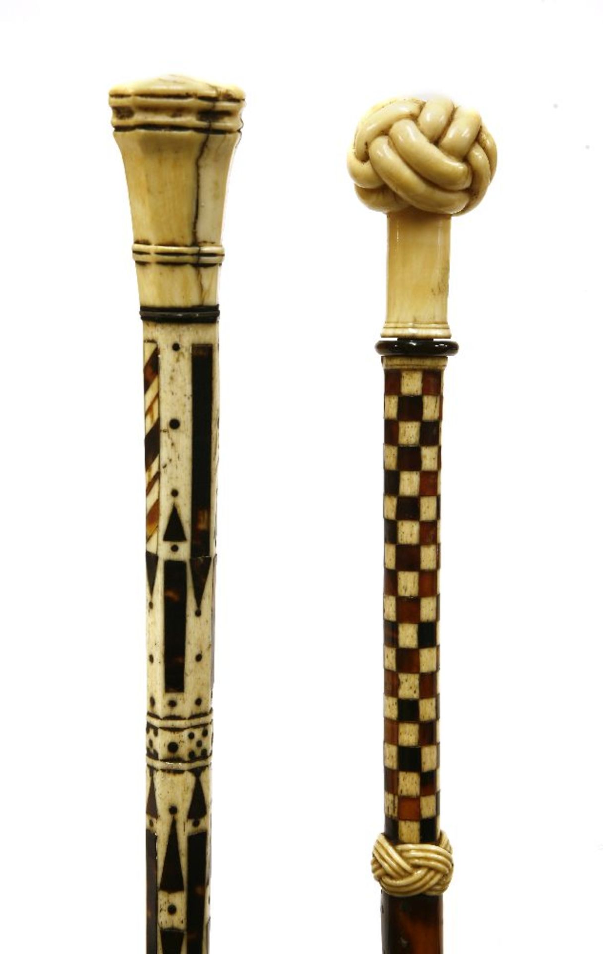 Two marine ivory and whalebone walking sticks,the first short, with a faceted octagonal knob over