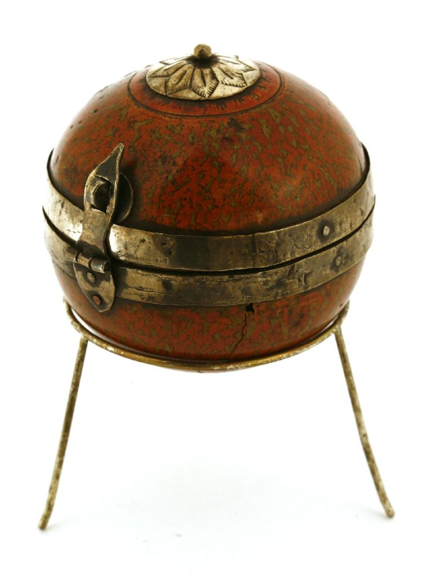 An Indian spherical lacquer and silver-mounted betel box,18th century, on a later white metal tripod