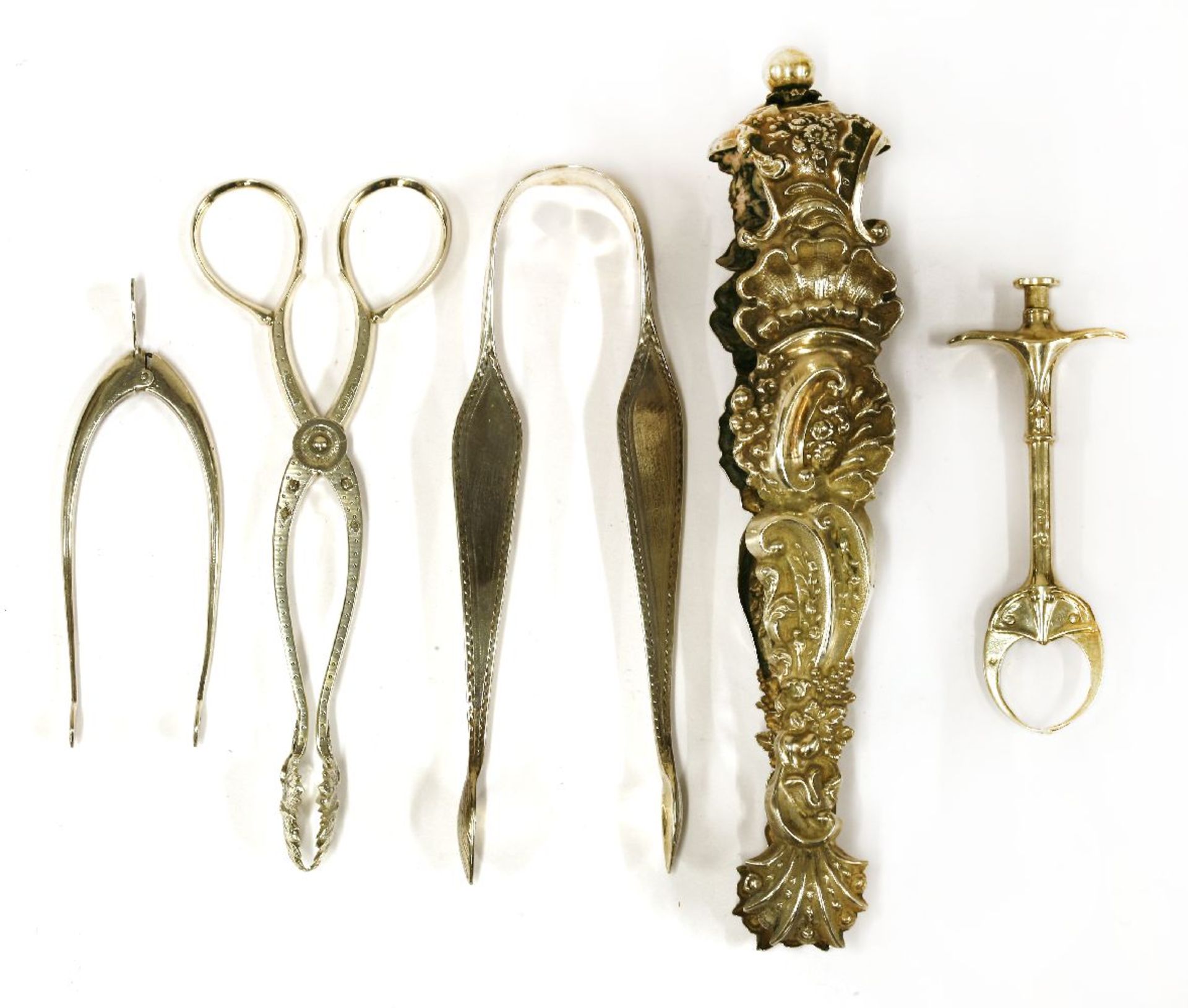 A pair of spring-action sugar nips,Chester 1908,a pair of repoussé silver sugar tongs,probably