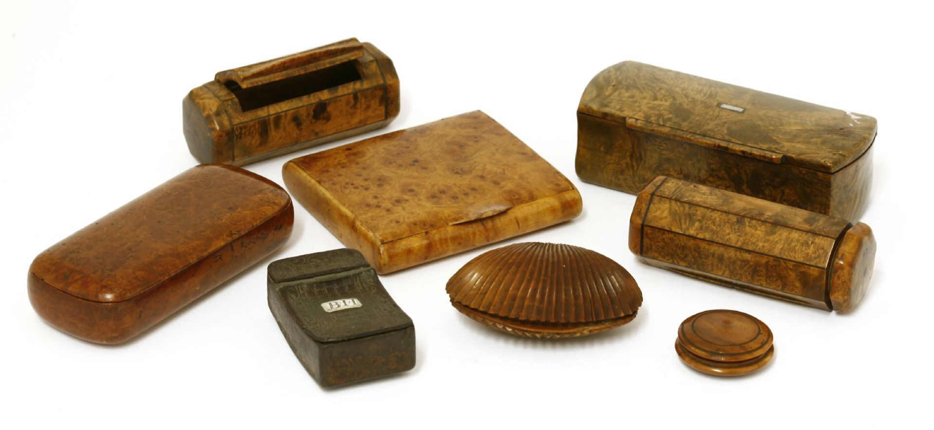 A collection of treen and papier mâché snuff boxes,19th and early 20th century, to include a pair of