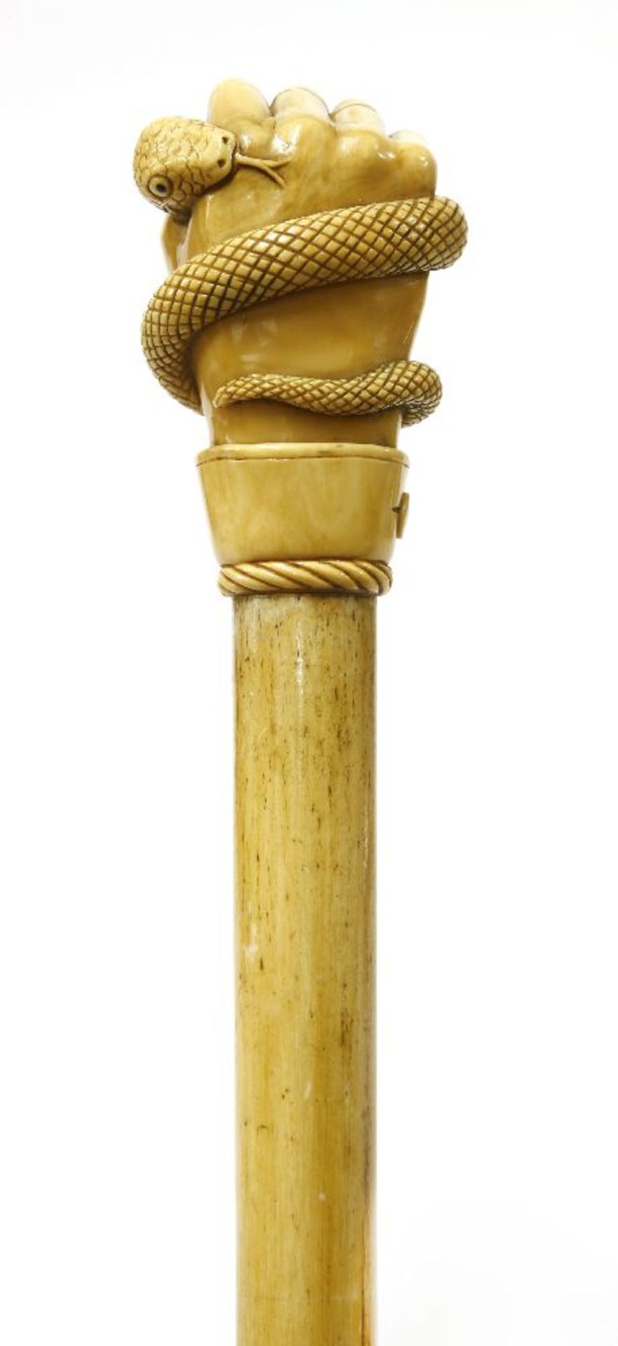 A marine ivory and whalebone walking stick,the top finely carved with a hand gripping a serpent, the - Image 2 of 3