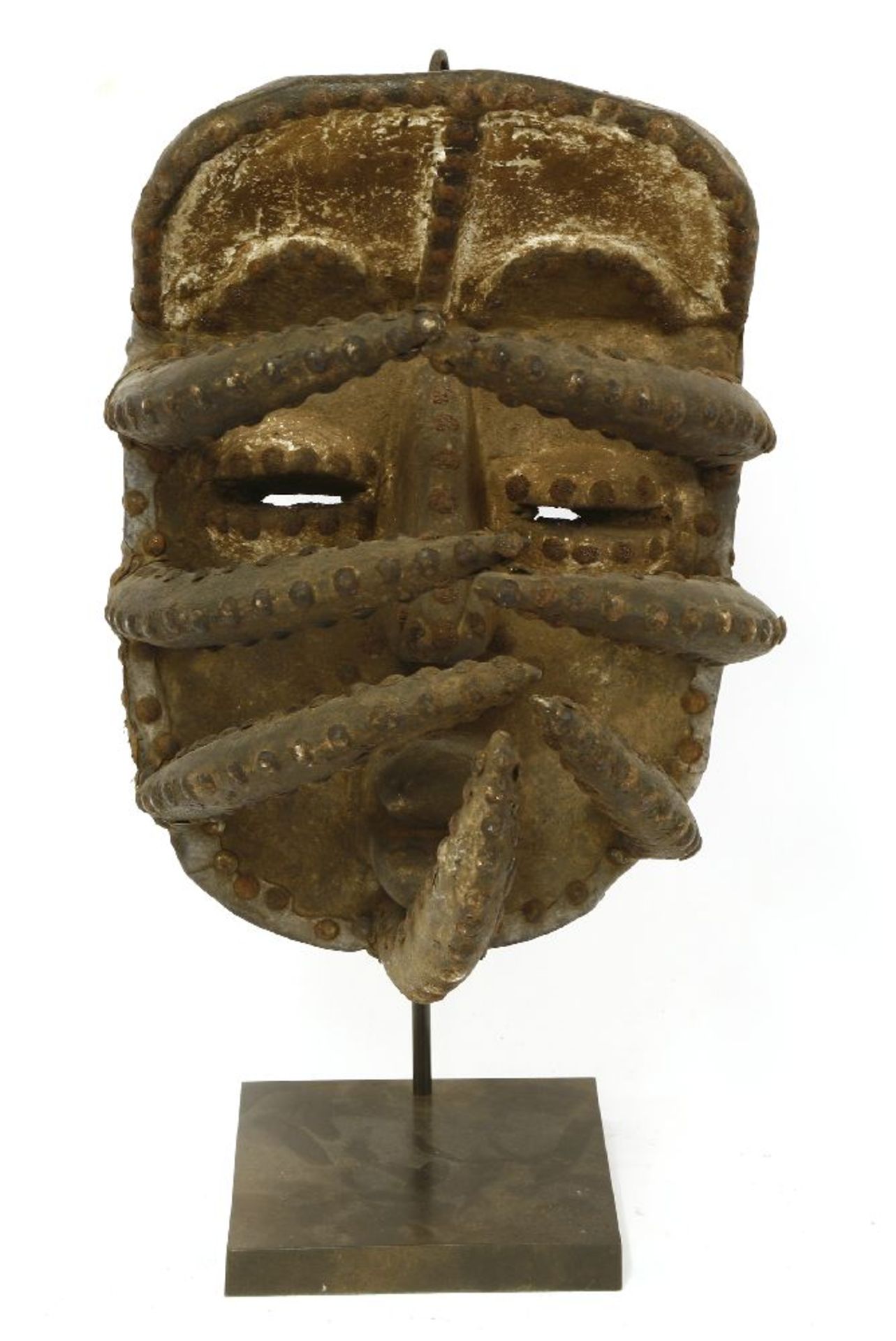 A Dan mask,Ivory Coast,47cm high overall, on stand