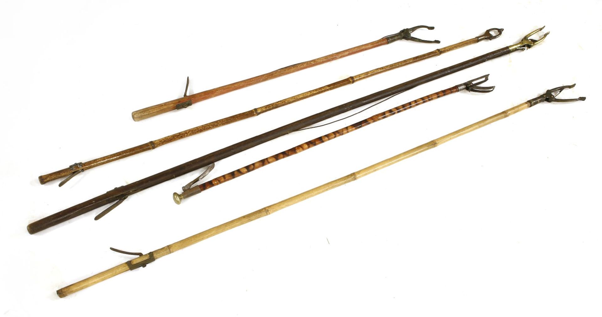 A collection of Regency and later 'long arm' grabs,together with a botanist's fruit cutter cane,by C