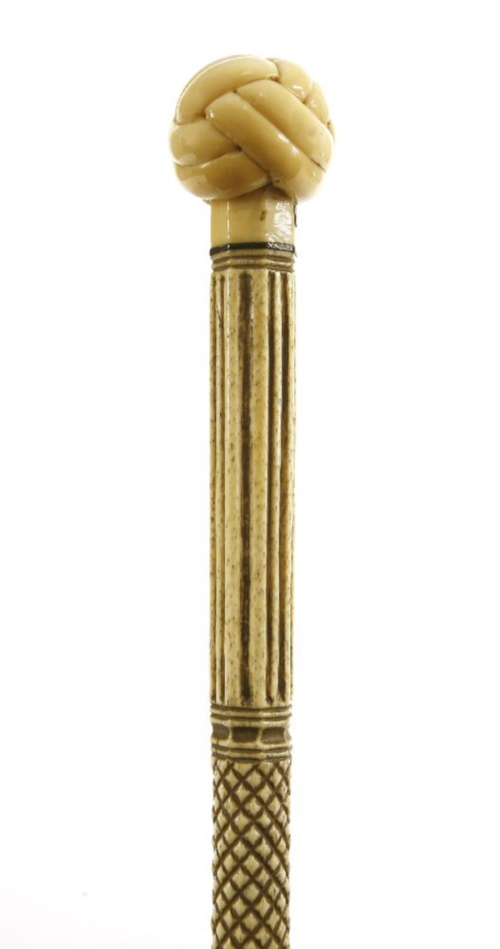 A marine ivory and whalebone walking stick,the handle carved as a Turk's head knot over a baleen