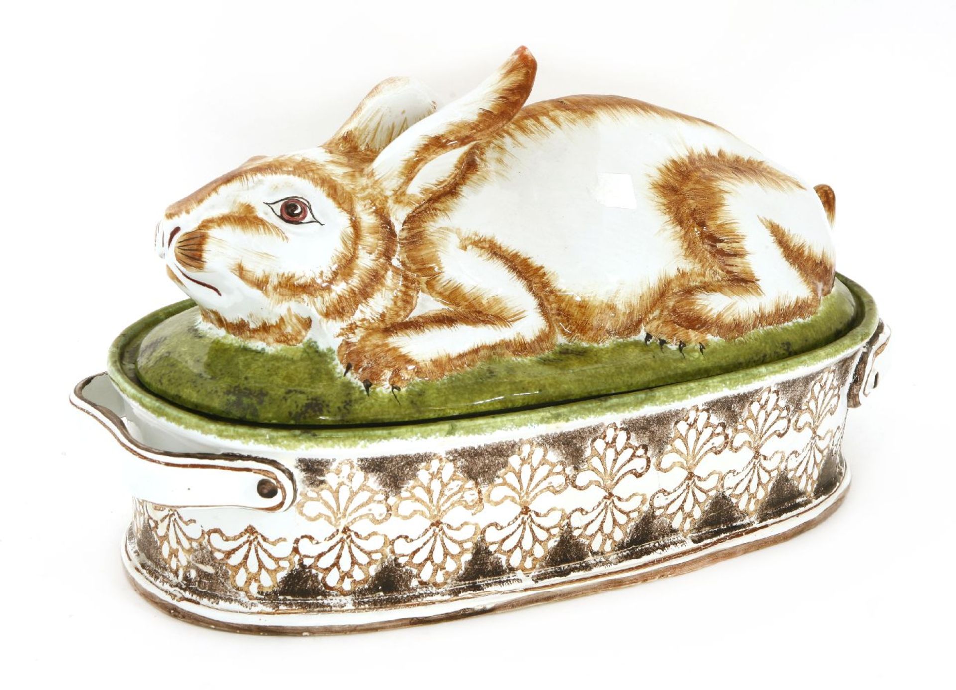 A large French faience jugged hare tureen and cover, the cover modelled as a crouching hare, the
