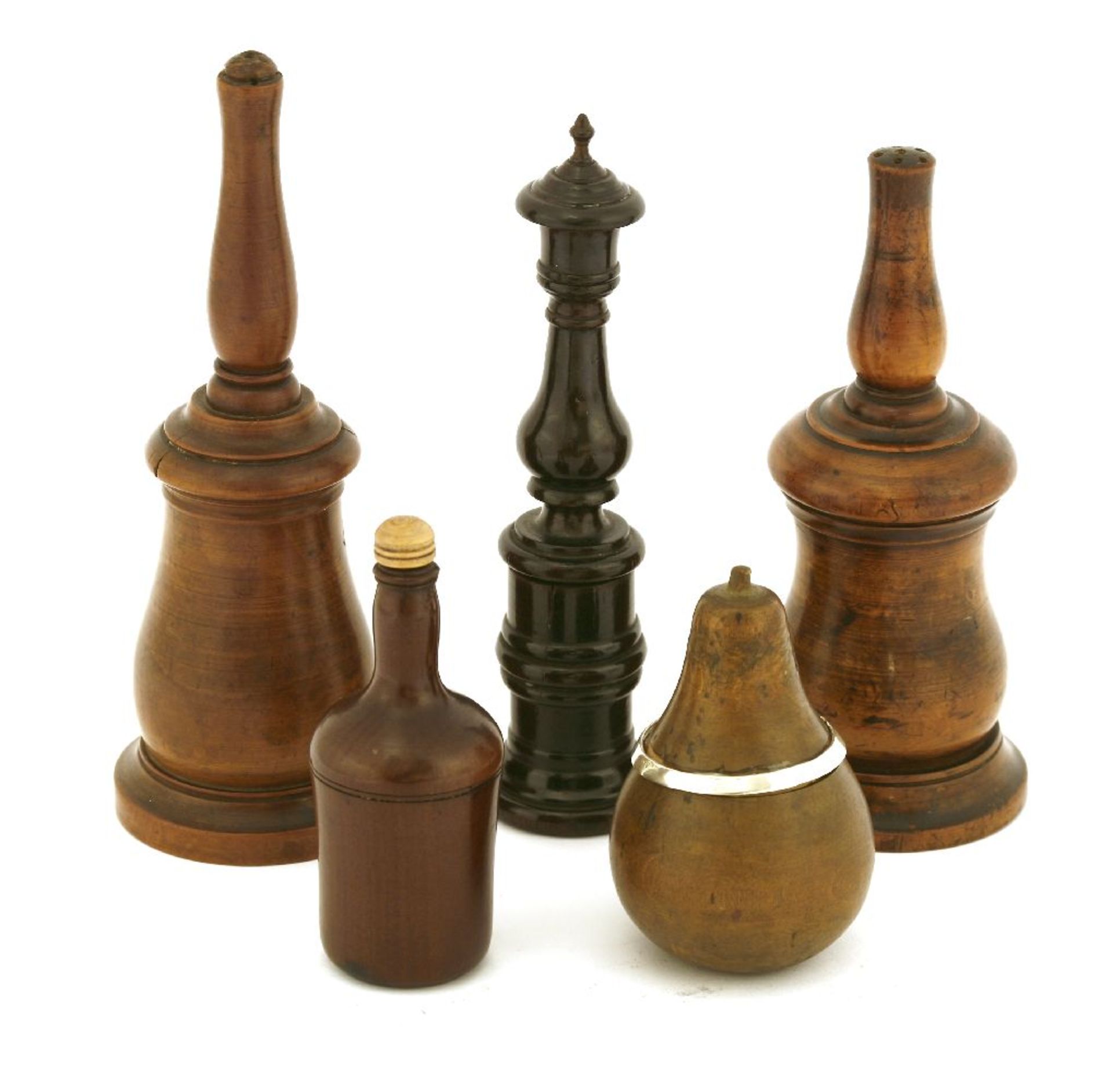 A collection of treen items,comprising: two George III turned boxwood glove powderers,the largest