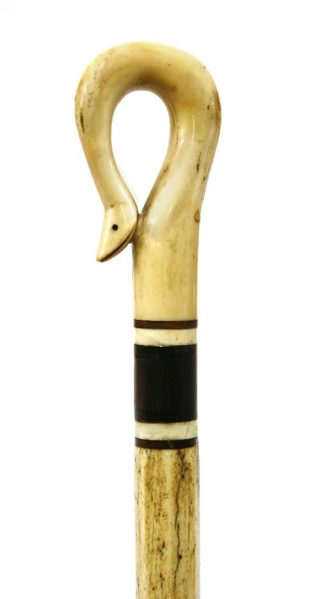 A marine ivory and whalebone walking stick,the snake's head handle over three baleen discs and an