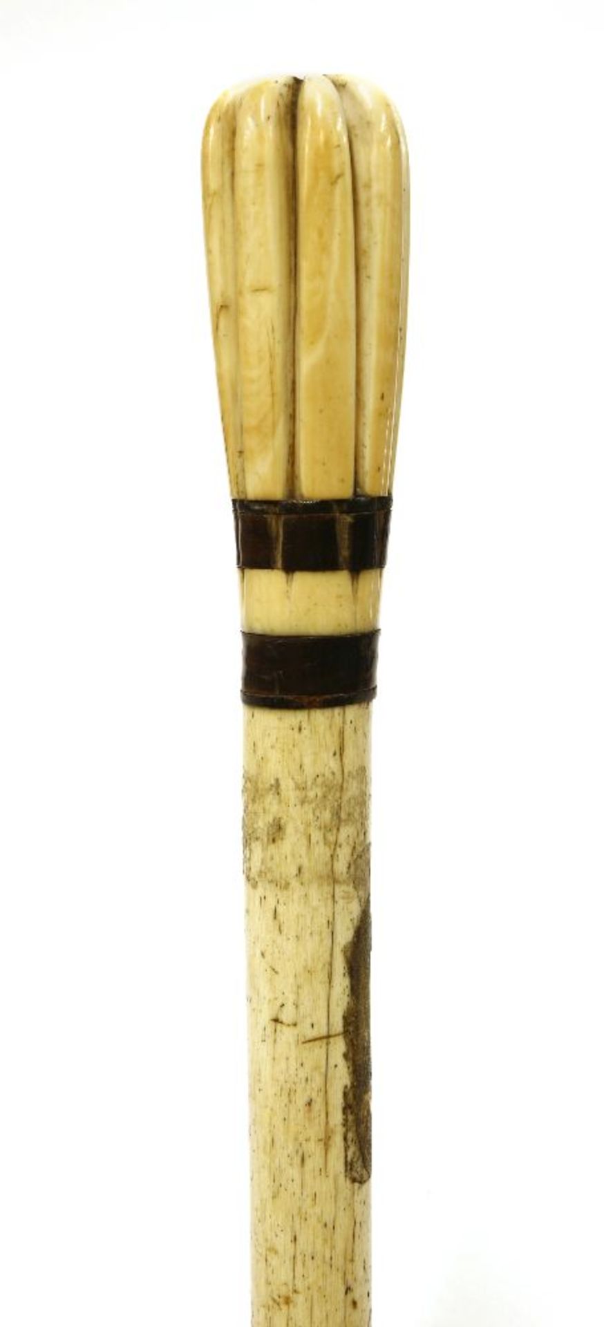 A marine ivory and whalebone walking stick,with an elongated eight segment handle, two baleen