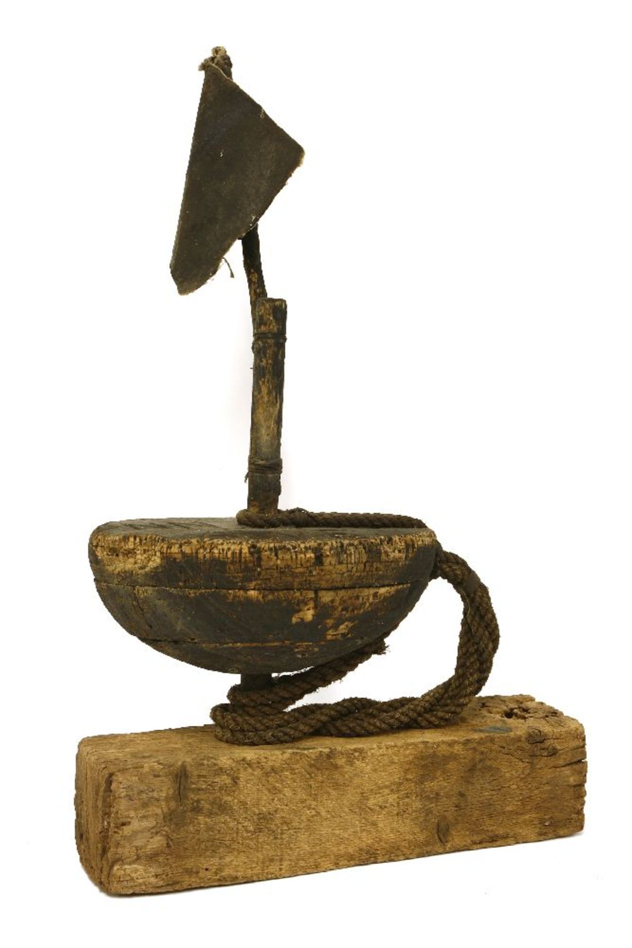 A folk art cork lobster pot float, possibly American, with a black flag and mounted on an oak