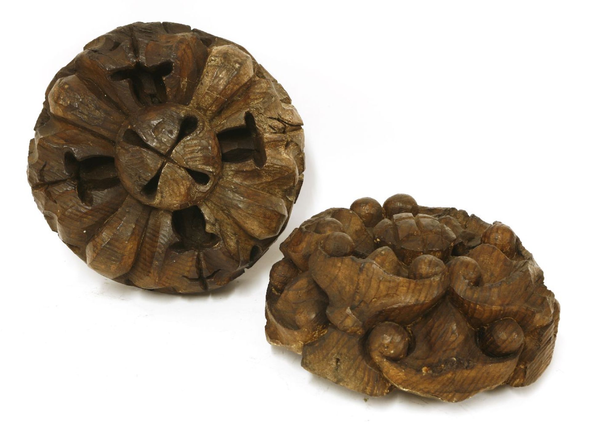 Two carved pine ceiling bosses,19th century,30cm diameter (2)Provenance: The Collection of Mr and