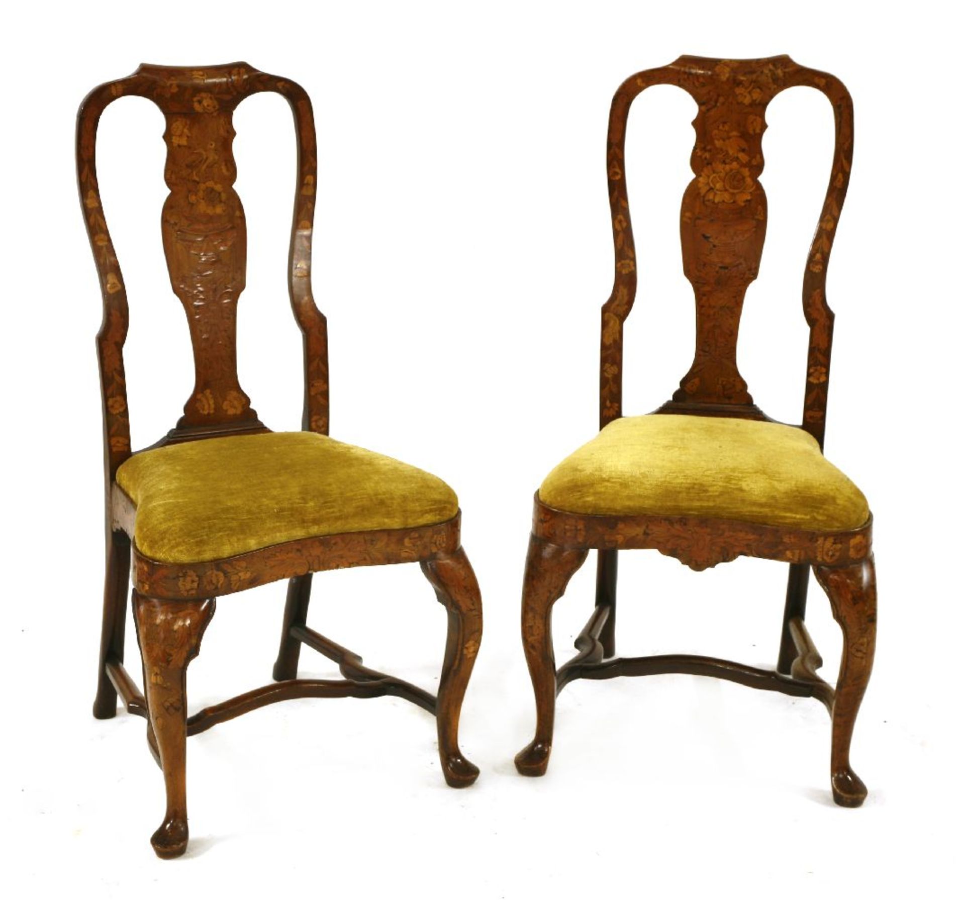A pair of Dutch marquetry and walnut single chairs,18th century, the shaped backs with baluster