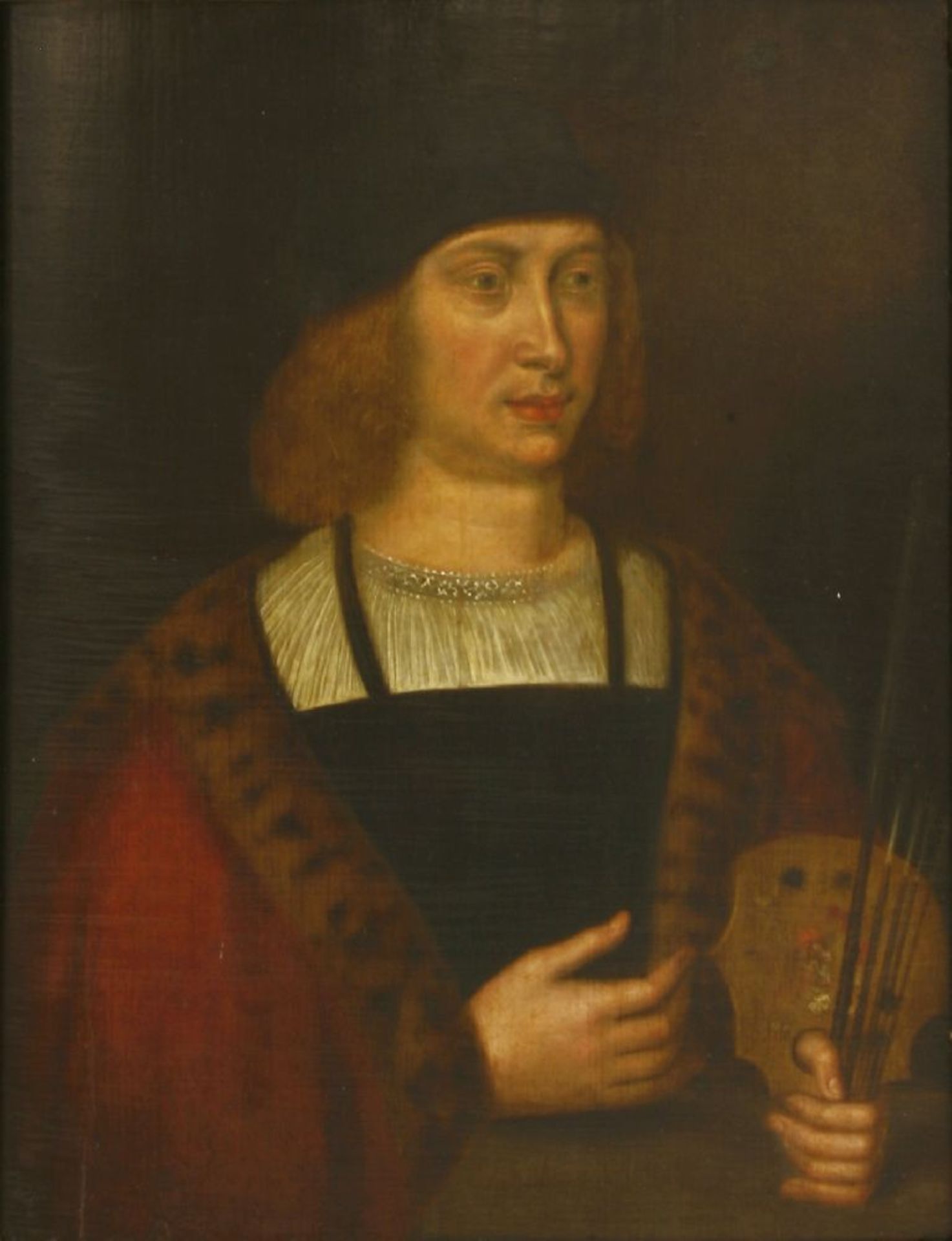 Manner of Quentin Matsys PORTRAIT OF AN ARTIST, HALF LENGTH, IN A FUR-TRIMMED CLOAK AND HOLDING A