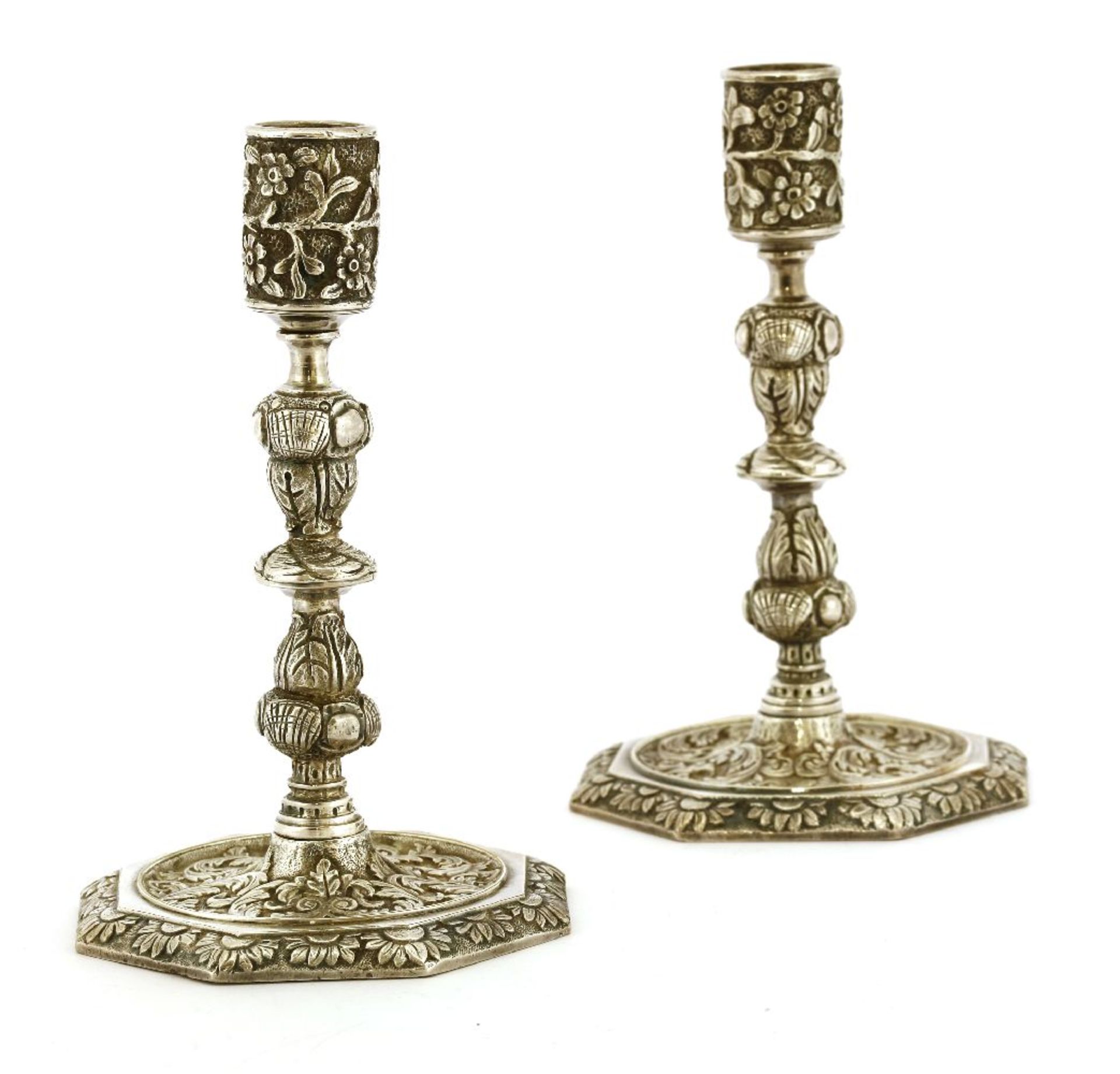 A pair of 17th century-style cast nickel candlesticks,each with a floral cast stem on an octagonal
