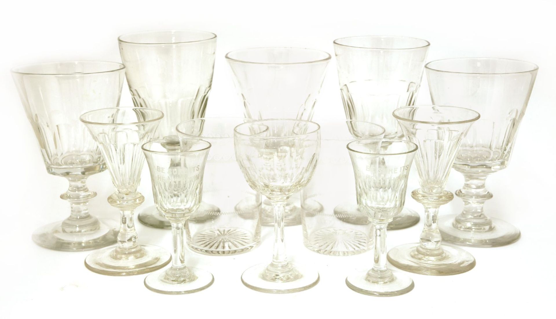 A matched set of sixteen wine glasses,19th century and later, each with a half fluted bowl on a