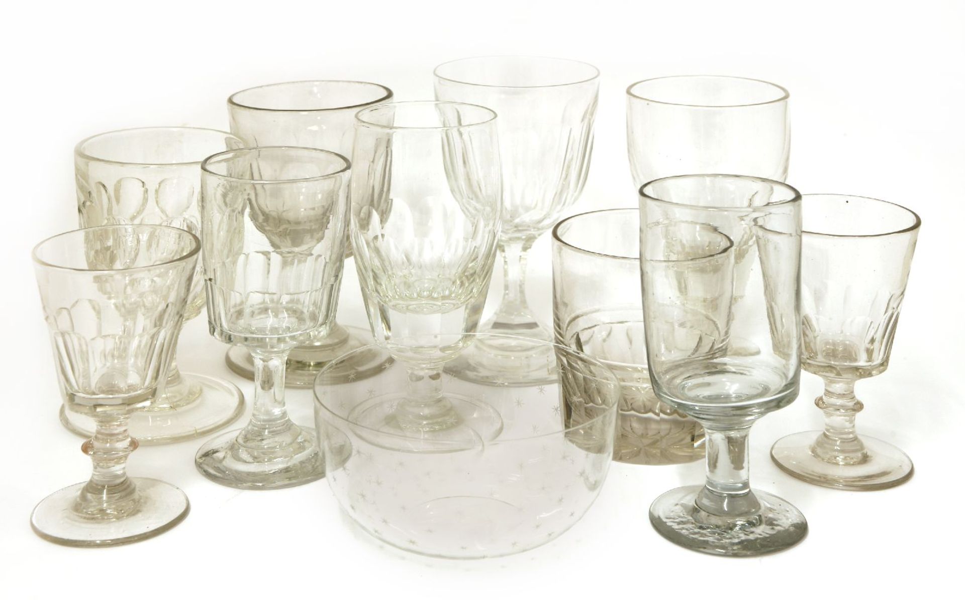 Seven glass tumblers, 19th century, each with a faceted and star cut base,10cm high, together with a