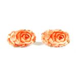 A pair of gilt metal carved coral floral screw back earrings