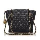 A Chanel Matelasse Chain Tote Bag, featuring a quilted leather body, gold tone hardware, and top zip