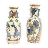 A near pair of Persian hand painted twin handled pottery vases, one decorated with fishes and the