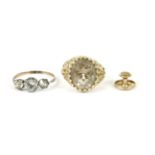 A 9ct gold single stone smokey quartz ring, 4.71g, (shoulders damaged), a three stone paste ring,